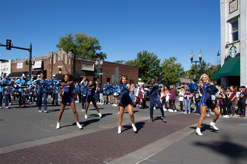 Students walk in the homecoming parade